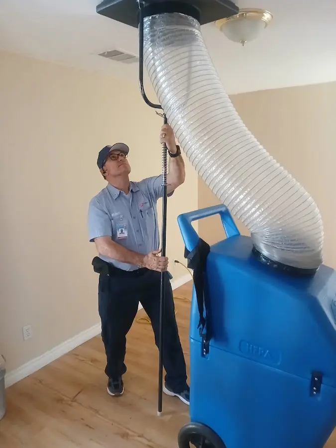 Furnace Tune-Up technician using HEPA equipment in El Paso
